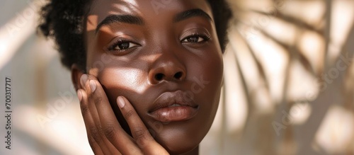 Skincare and wellness for black women, featuring facial treatment for skin health and a natural glow, with a model showcasing fashionable hands after receiving collagen, botox, and cosmetic face