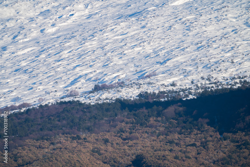 Obraz na płótnie Bronte town under the snowy and majestic volcano Etna and a cloudy blue sky w salonie