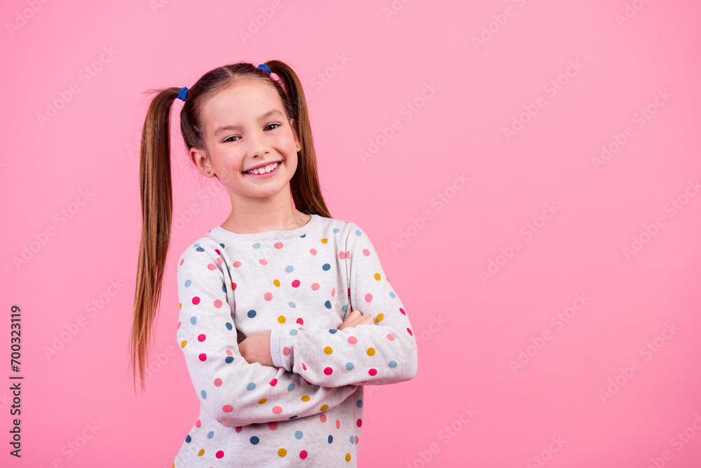 Portrait of optimistic adorable schoolgirl with ponytails dressed dotted sleepwear holding palms folded isolated on pink color background Portrait of optimistic adorable schoolgirl with ponytails dressed dotted sleepwear holding palms folded isolated on pink color background