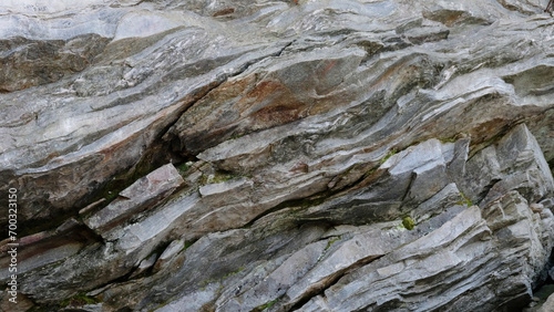 Rock wall in nature from North Carolina as aged texture background.