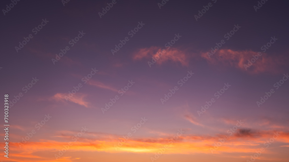 Sunset Sky,Clouds in the Evening Light with Orange, Yellow and Purple,Beautiful Nature Sunlight in  Golden Hour after Sundown,Horizon Romantic Sky with Dusk Twilight in Summer Time