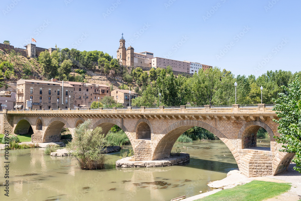 Sant Miquel old bridge over Segre river with a view to the Sant Crist in Balaguer, comarca of Noguera, Province of Lleida, Catalonia, Spain