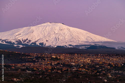 Obraz na płótnie Bronte town under the snowy and majestic volcano Etna and a cloudy blue sky w salonie