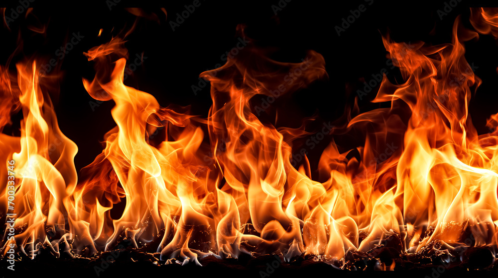 Fire flames isolated on black background. Realistic fire flames texture. Fire flames isolated on black background. Realistic fire flames texture.