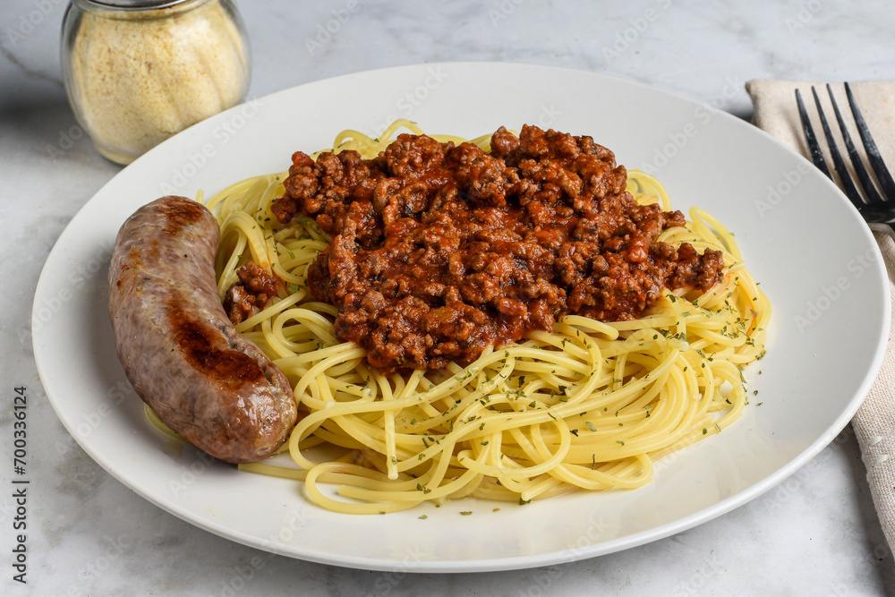 spaghetti served with hamburg sauce  and italian sausage