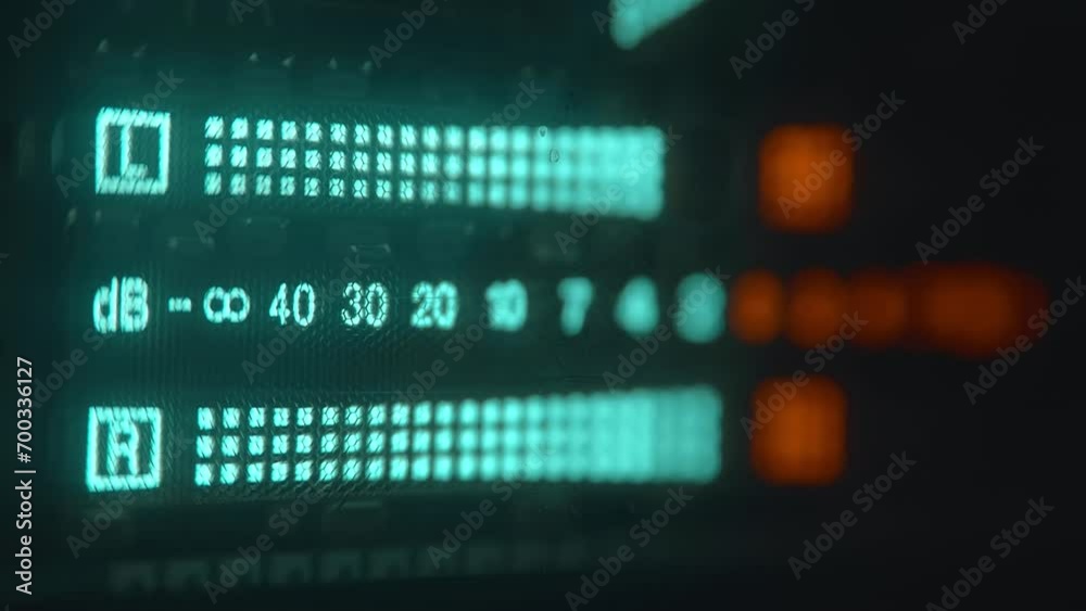 The level indicator of а music from professional recorder is glows blue and shows the decibel range and overload area with high accuracy. Closeup. Macro. Shallow depth of field The level indicator of а music from professional recorder is glows blue and shows the decibel range and overload area with high accuracy. Closeup. Macro. Shallow depth of field