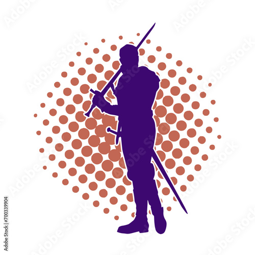 Silhouette of a male warrior in action pose with sword weapon. Silhouette of a man fighter carrying sword weapon.