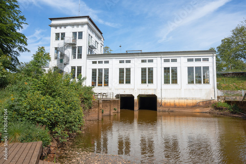 Old hydroelectric power plant building, clean energy hydroelectric power plant