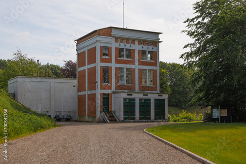 Old hydroelectric power plant building, clean energy hydroelectric power plant