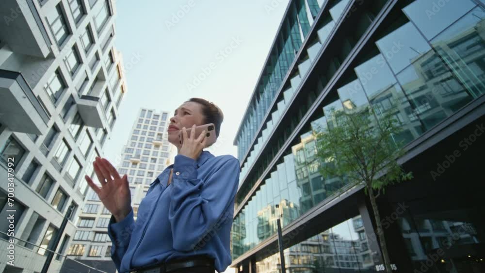 Annoyed business woman calling at modern downtown close up. Nervous woman talk Annoyed business woman calling at modern downtown close up. Nervous woman talk