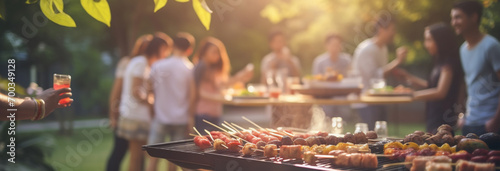 friends having barbecue party at backyard, friends having fun on vacation, enjoying summer weekend © Daniel