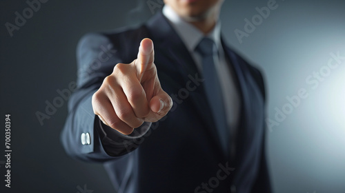 Warning from a Businessman, showing the finger. Advertising concept, a businessman is warning you. Businessman pressing button on a virtual screen
