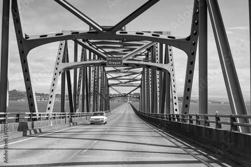 Archival black and white view driving across the Astoria bridge between Washington and Oregon.  Photo taken in May 1992.   photo