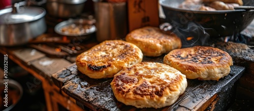Chinese brown sugar pancake, griddle buns in Chengdu, guo kui. photo