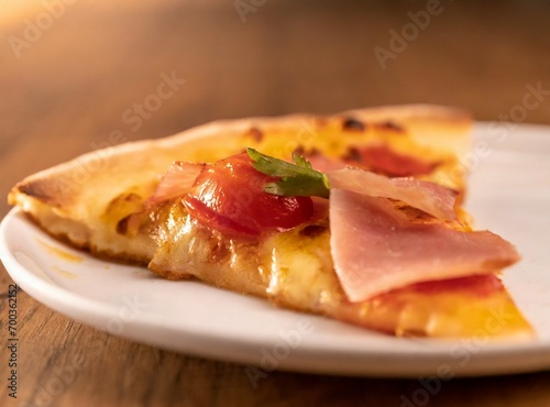Slice of pizza with raw ham closeup