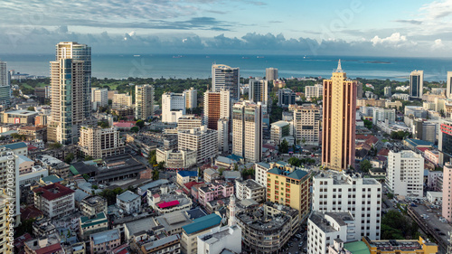 Cityscape of Dar es Salaam at sunset featuring residential and office buildings. photo