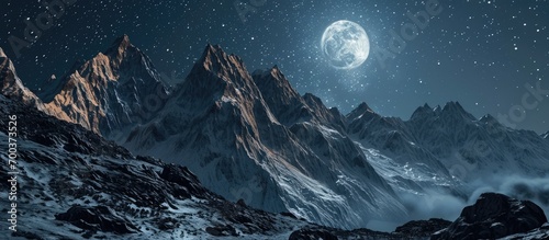Moonlit mountain range with celestial galaxy in the night.