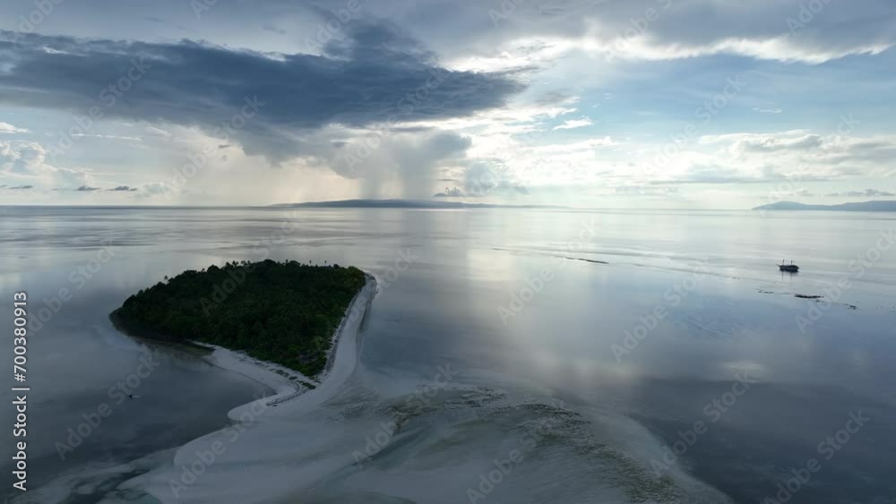 Early morning light illuminates the remote island of Koon near Seram, Indonesia. This scenic island's coral reefs, and the surrounding seas, support extraordinary marine biodiversity. Early morning light illuminates the remote island of Koon near Seram, Indonesia. This scenic island's coral reefs, and the surrounding seas, support extraordinary marine biodiversity.