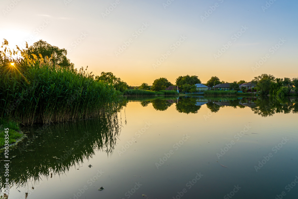 Lake in the village. Background with selective focus and copy space