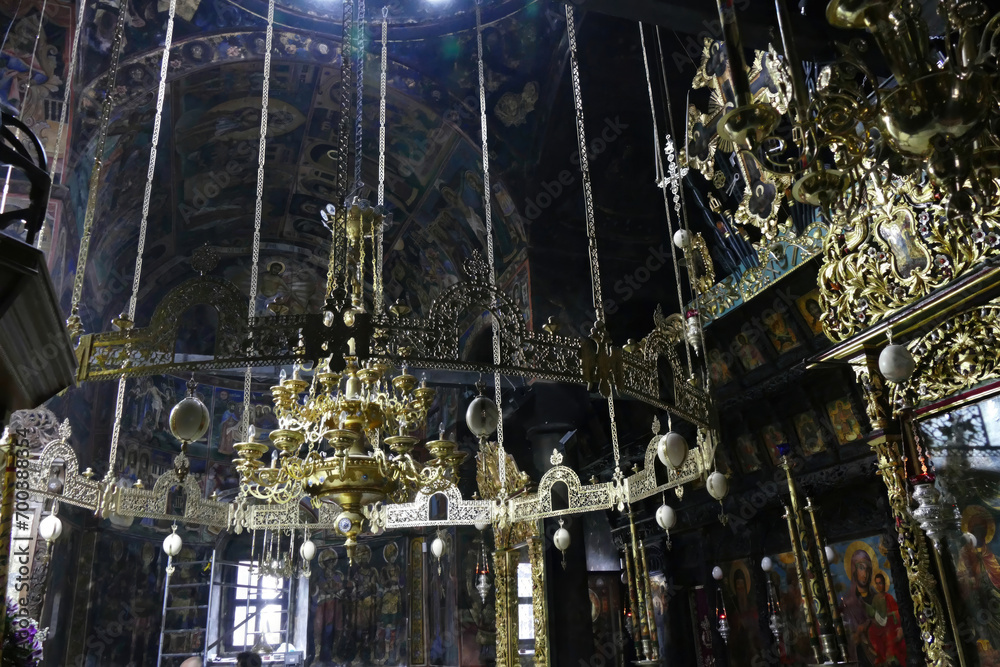 Chandelier with frescoes on walls and Iconostasis