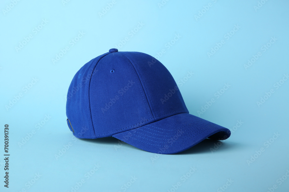 Fototapeta premium Stylish baseball cap on light blue background