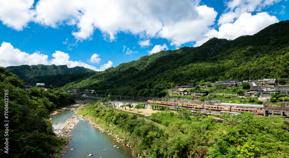 train goes by the river with beautiful view, in New Taipei City, Taiwan.