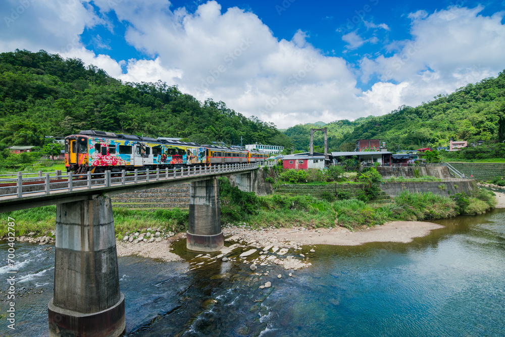 train go through the river with beautiful view, in New Taipei City, Taiwan.