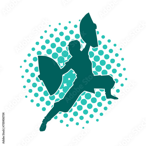 Silhouette of a woman in oriental martial art pose. Silhouette of a female in martial art move.