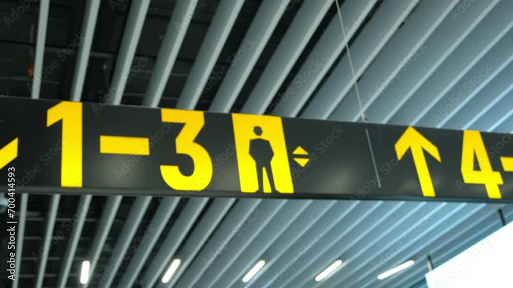 Guide sign directing to different gates. Modern Airport Terminal. International. Hall Guide sign directing to different gates. Modern Airport Terminal. International. Hall