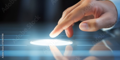 A business man's hand pointing at search button on a touch screen  photo
