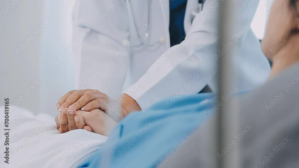 Asian female doctor giving hope and encourage to stressed woman patient at hospital. Smiling doctor woman touching on patient shoulder to support take care and helping . Supported and Encouraged Asian female doctor giving hope and encourage to stressed woman patient at hospital. Smiling doctor woman touching on patient shoulder to support take care and helping . Supported and Encouraged