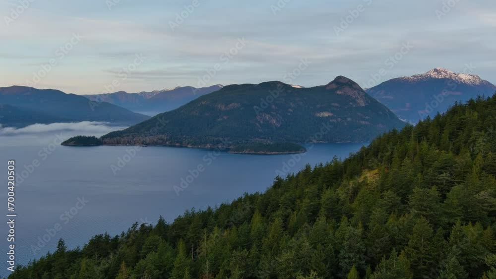 Mountains, Trees and Islands in Howe Sound. Winter Season, Cloudy Morning. Aerial Landscape. BC, Canada. Mountains, Trees and Islands in Howe Sound. Winter Season, Cloudy Morning. Aerial Landscape. BC, Canada.