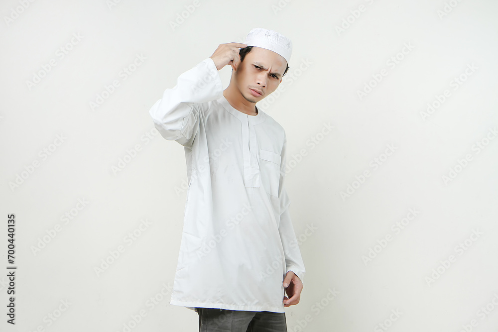 asian muslim man give ponting head gesture. People religious Islam lifestyle concept. celebration Ramadan and ied Mubarak. on isolated background. asian muslim man give ponting head gesture. People religious Islam lifestyle concept. celebration Ramadan and ied Mubarak. on isolated background.