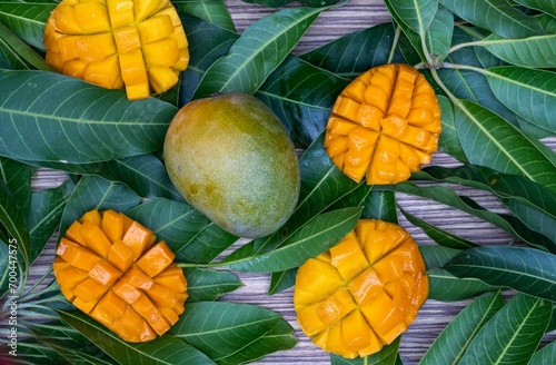 Ripe Mangoes with Green Mango Leaves in Horizontal Orientation
