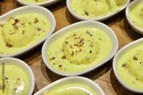 Rasmalai, Rossomalai, Roshmolai, Rasamalei is a very popular Indian dessert. It's a Similar dish to Rasgulla. It is a sweet delicacy made with Indian cottage cheese or chenaa photo