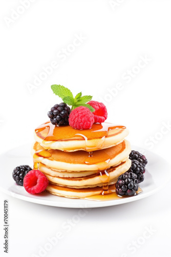 Pancakes with Mixed Berries and Mint on White Background.