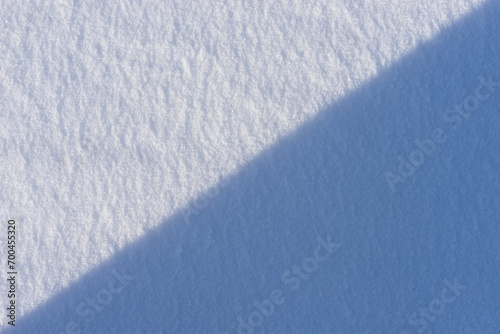 Fallen snow as a background. Texture of fresh clean snow. Place for text. Top view.