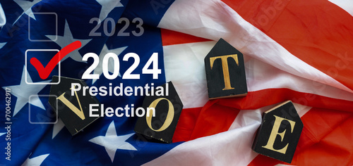 2024 presidential election year in United States as illustration template on blue background wall with reflection. photo