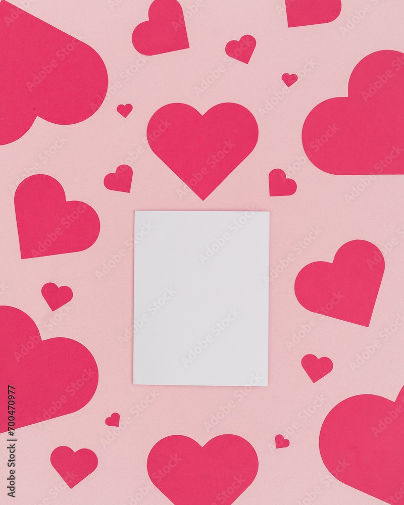 Valentine Day Pink Background with Red Hearts a White Card for Copy