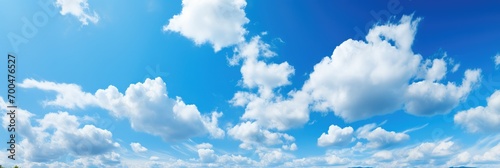 Vibrant blue sky with fluffy white clouds. Generative AI. © visoot