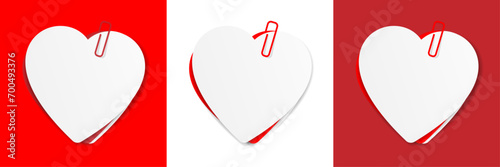 Several heart-shaped memo sheets held by a paper clip