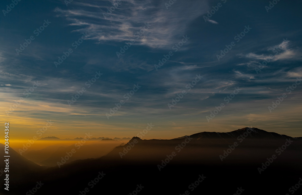 Sunset over the mountains of Como lake with Monte Rosa massif on the horizon, Italy landscape