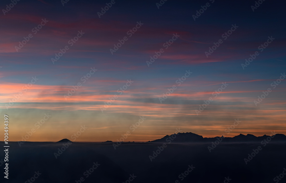 The Monte Rosa massif in silhouette at sunset