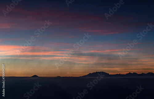 The Monte Rosa massif in silhouette at sunset photo