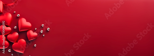 Festive banner background for Valentine's day, featuring bright red and white hearts with copy text space. Concept for a Valentine's Day holiday banner. © Tetiana