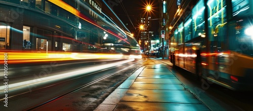 Bus passing by in the street at night slow shutter speed motion. Creative Banner. Copyspace image