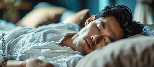 Asian man take a nap on sofa with snore take nap daydreaming in living rooms snoring Healthcare medical Sleep health man sleep at home Dream rest tired father dad day Sleep Apnea Sdb resting at photo