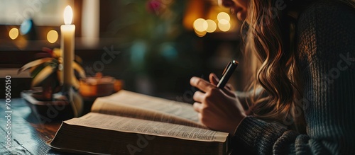 Bible study and writing woman with notes on religion at desk in home Christian faith and knowledge of God Reading hope and girl at table with holy book learning gospel inspiration and prayer