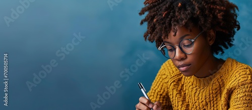 African female psychologist making notes and talking to group of difficult teenagers during therapy session. Creative Banner. Copyspace image