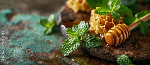 close up of peppemint leaves with wood honeycomb stick. Creative Banner. Copyspace image photo